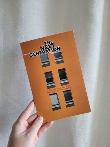 A book with an orange cover featuring six greyscale windows, and the words The Next Generation